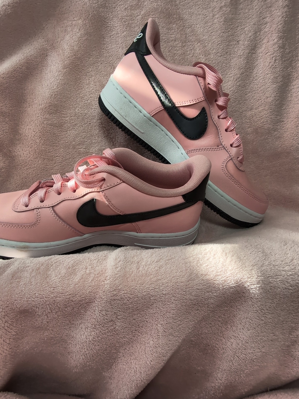 Nike Women’s Pink Low-Top Sneakers with Black Swoosh
